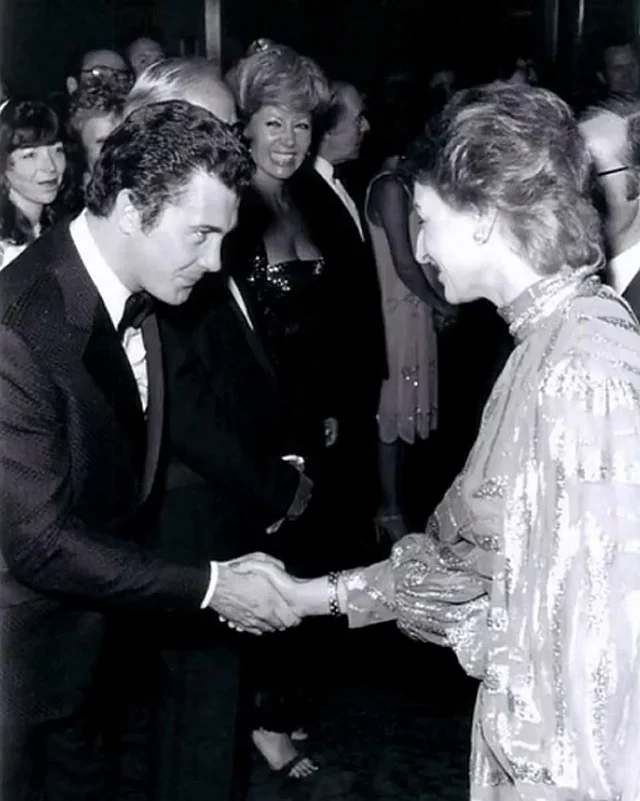 A photo of Lewis Collins greeting Princess Diana for Who Dares Wins. 